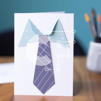 Intra Συλλεκτικό Ξύλινο Παζλ Plywood  4mm - Γραβάτα σε στυλ origami σε λευκή κάρτα με υλικά γραφής και σκίτσου Σε Ξύλινο Κουτί - Διαστάσεις Puzzle: 10x10 cm – 25 κομμάτια - Image 1