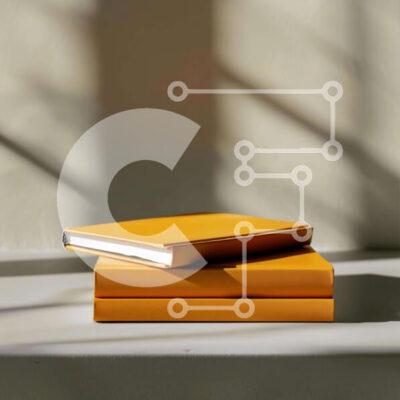 Intra Συλλεκτικό Ξύλινο Παζλ Plywood  4mm - Δύο κίτρινα βιβλία στοιβάζονται σε ένα τραπέζι Σε Ξύλινο Κουτί - Διαστάσεις Puzzle: 10x10 cm – 25 κομμάτια - Image 1