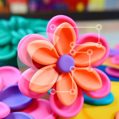 Intra Συλλεκτικό Ξύλινο Παζλ Plywood  4mm - Πολύχρωμα πλαστικά λουλούδια τοποθετημένα σε κύκλο Σε Ξύλινο Κουτί - Διαστάσεις Puzzle: 10x10 cm – 25 κομμάτια - Image 1