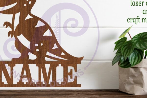 1758455708_Cute-T-Rex-shape-name-sign-svg-laser-cut-Graphics-104579516-1-1