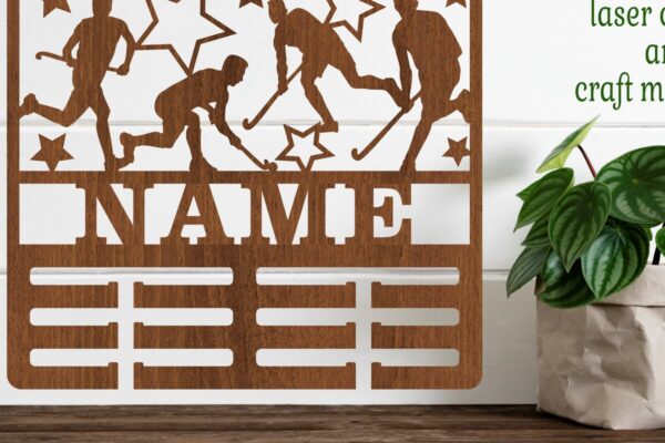 1758731138_Field-hockey-Male-medal-holder-SVG-file-Graphics-68115742