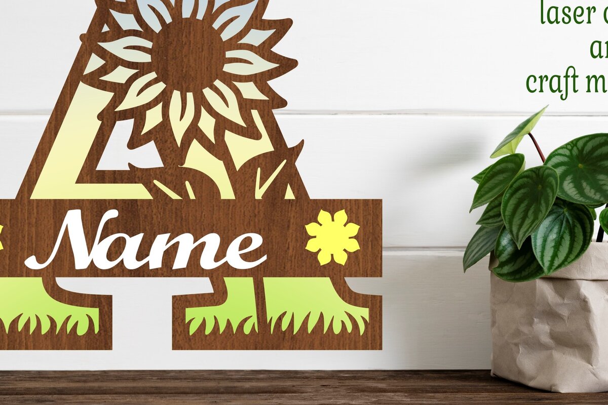 Intra απο ξύλο plywood 3mm-4mm πάχος – Μονόγραμμα ηλίανθου με κεφαλαίο γράμμα Δίασταση  20x20 cm INTRAFABR-75964998