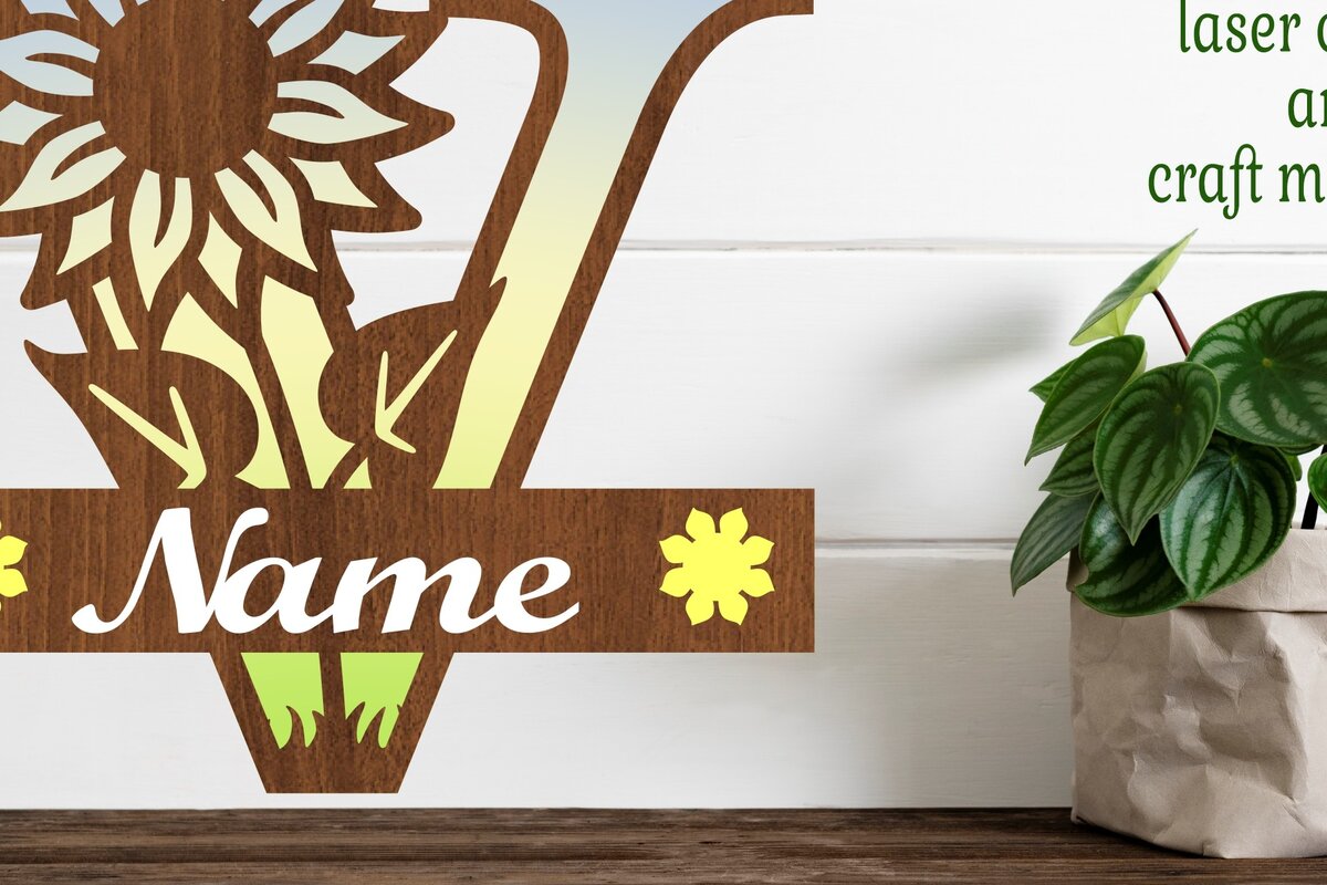 Intra απο ξύλο plywood 3mm-4mm πάχος – Ηλίανθος κεφαλαίο μονόγραμμα Γράμμα V Δίασταση  20x20 cm INTRAFABR-75965565